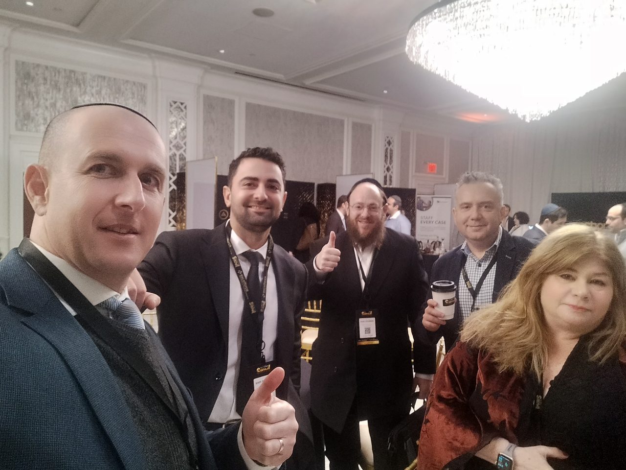 Tal Paperin with channel partners at a trade show